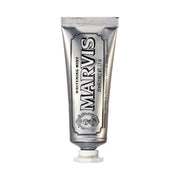 A tube of Marvis Whitening Mint Toothpaste with a silver label and distinctive branding.